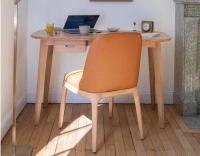 Designer chair natural stained wood and caramel leather