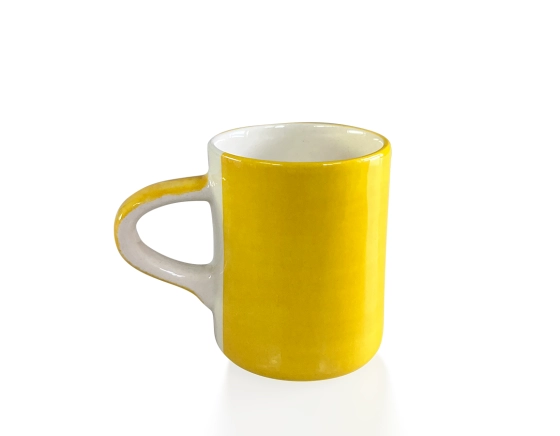 Plain yellow ceramic coffee mug