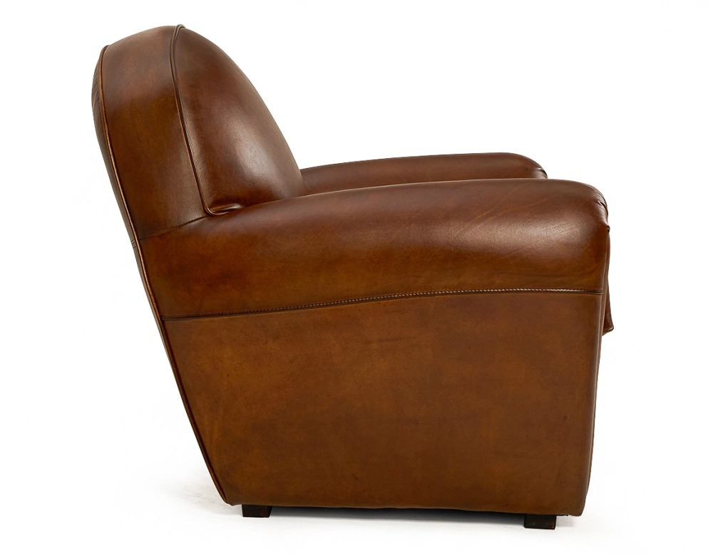 Fauteuil club cuir marron vintage accoudoirs passepoil