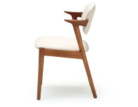 Scandinavian chair cherry wood stain with off-white fabric seat.