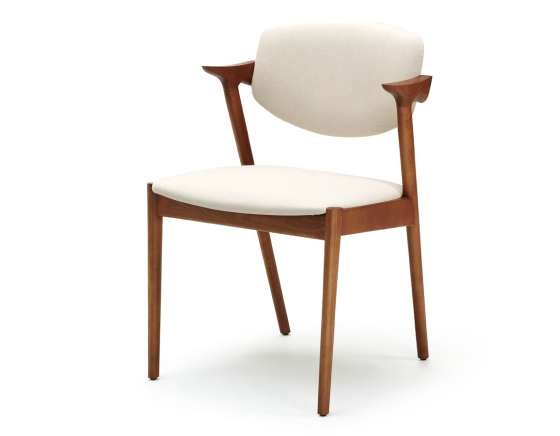 Scandinavian chair cherry wood stain with off-white fabric seat.