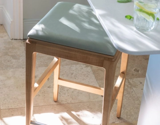 H80 cm designer bar stool natural tint wood, sage green fabric seat