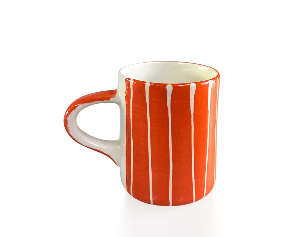 Orange ribbed ceramic coffee cup
