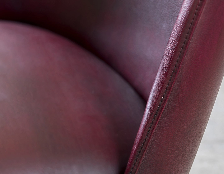 Leather pouffe burgundy studded edge