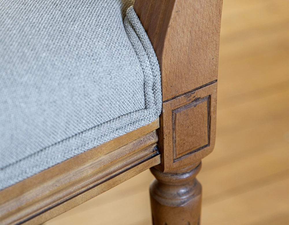 Antique Louis XVI style chair wood stained in an antique style and light grey fabric