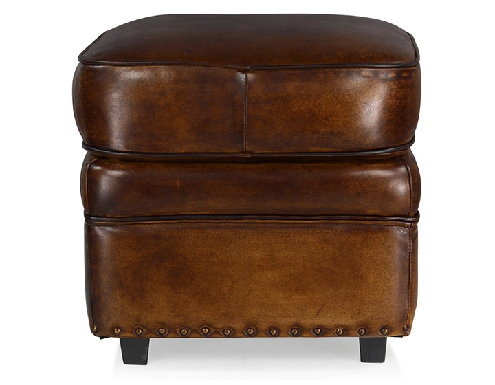 Pouf cuir marron soutenu bord clouté