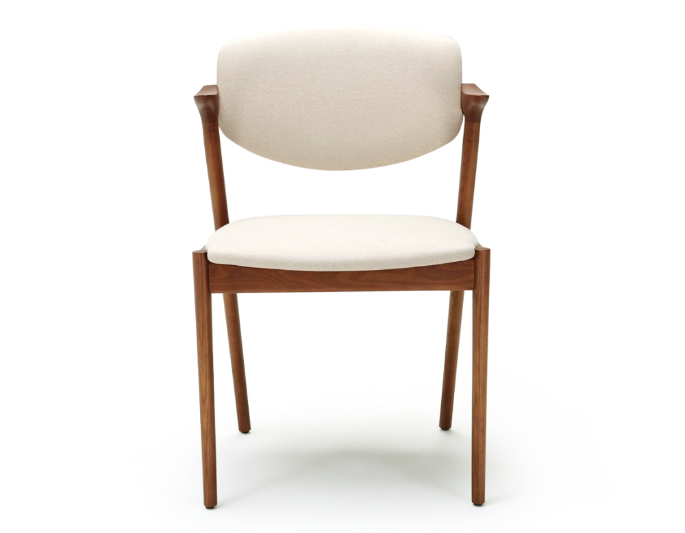 Scandinavian chair cherry wood stain with off-white fabric seat.