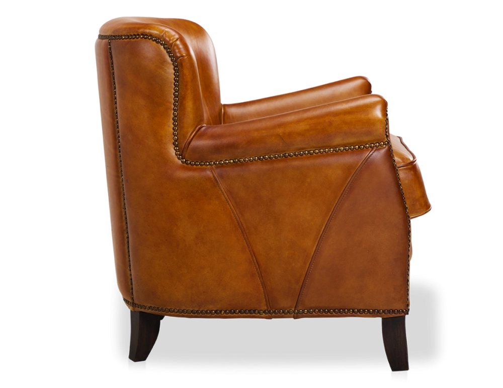 Fauteuil club cuir cognac accoudoirs cloutés
