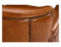Fauteuil club cuir marron clair accoudoirs cloutés