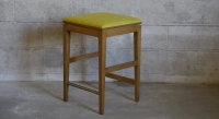 Tabouret de bar design H65 cm bois teinte vintage assise tissu jaune