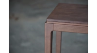 Design bar stool H60 cm walnut-stained wood seat.