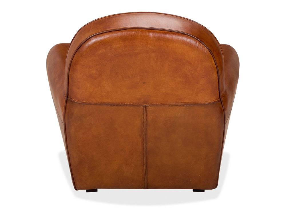 Fauteuil club cuir marron clair accoudoirs cloutés