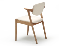 Chaise scandinave bois teinte naturelle assise tissu blanc cassé