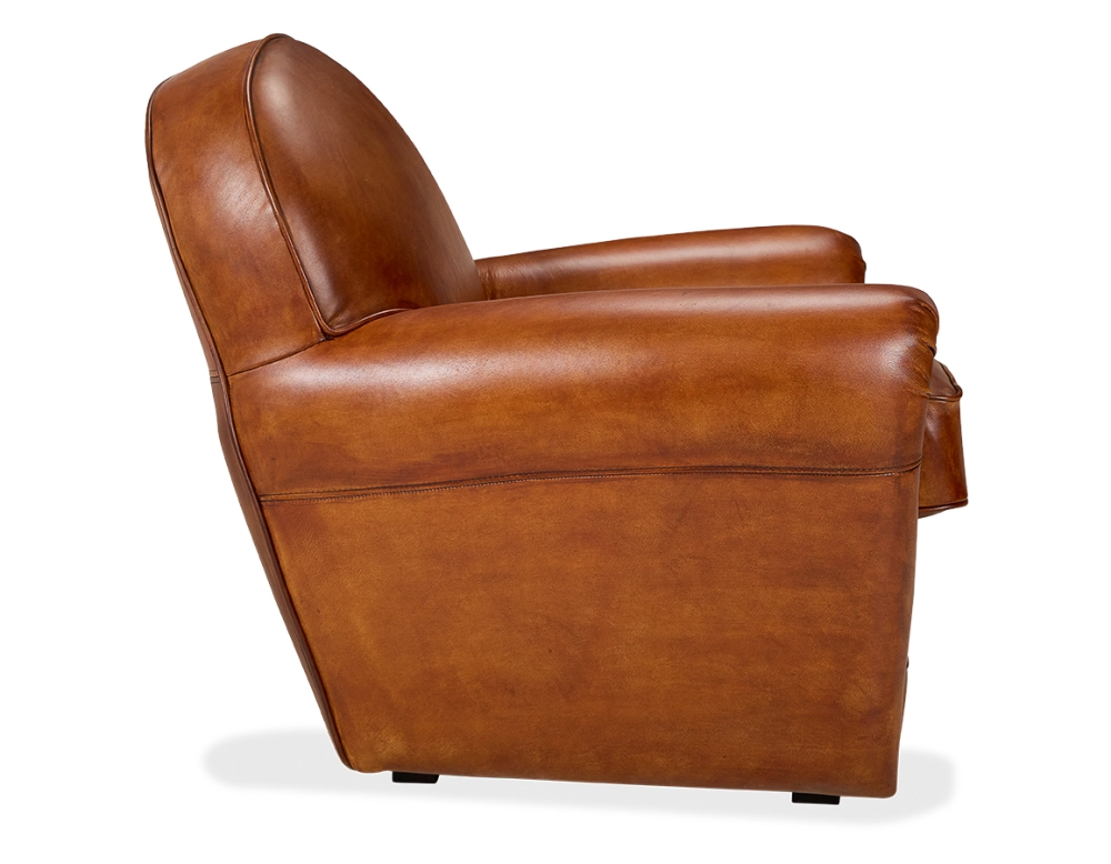 Fauteuil club cuir marron clair accoudoirs cloutés