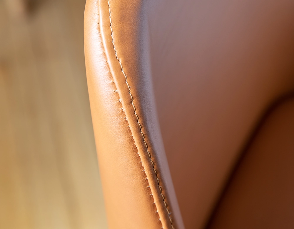 Designer chair natural stained wood and caramel leather