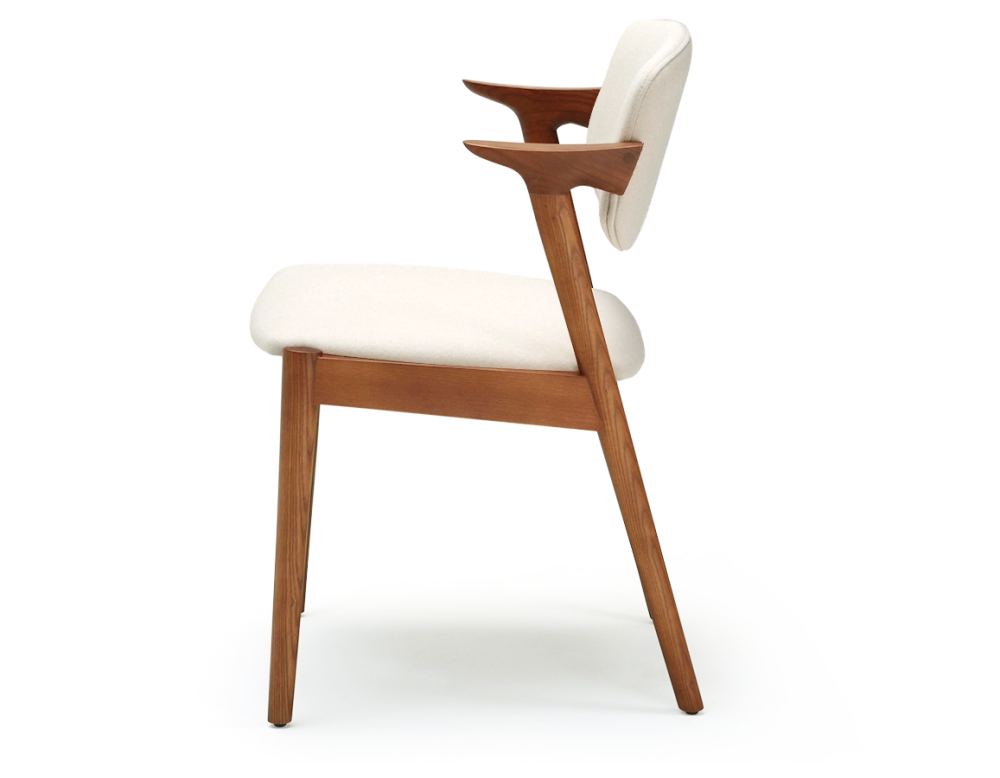 Scandinavian chair cherry wood stain with off-white fabric seat.