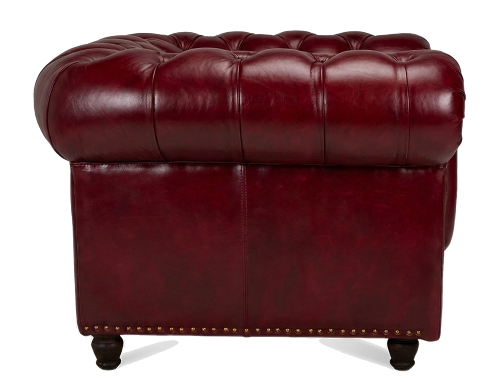 Fauteuil Chesterfield cuir rouge carmin accoudoirs cloutés