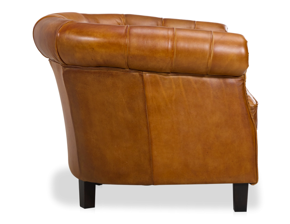 Fauteuil chesterfield cuir cognac accoudoirs cloutés