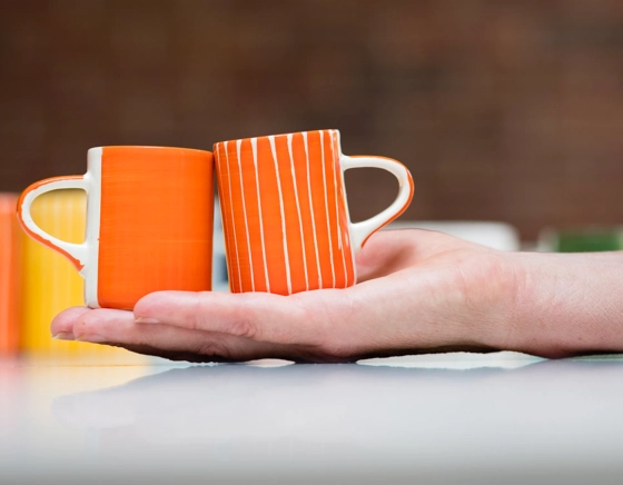 Plain orange ceramic coffee cup
