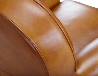 Fauteuil club cuir cognac accoudoirs cloutés