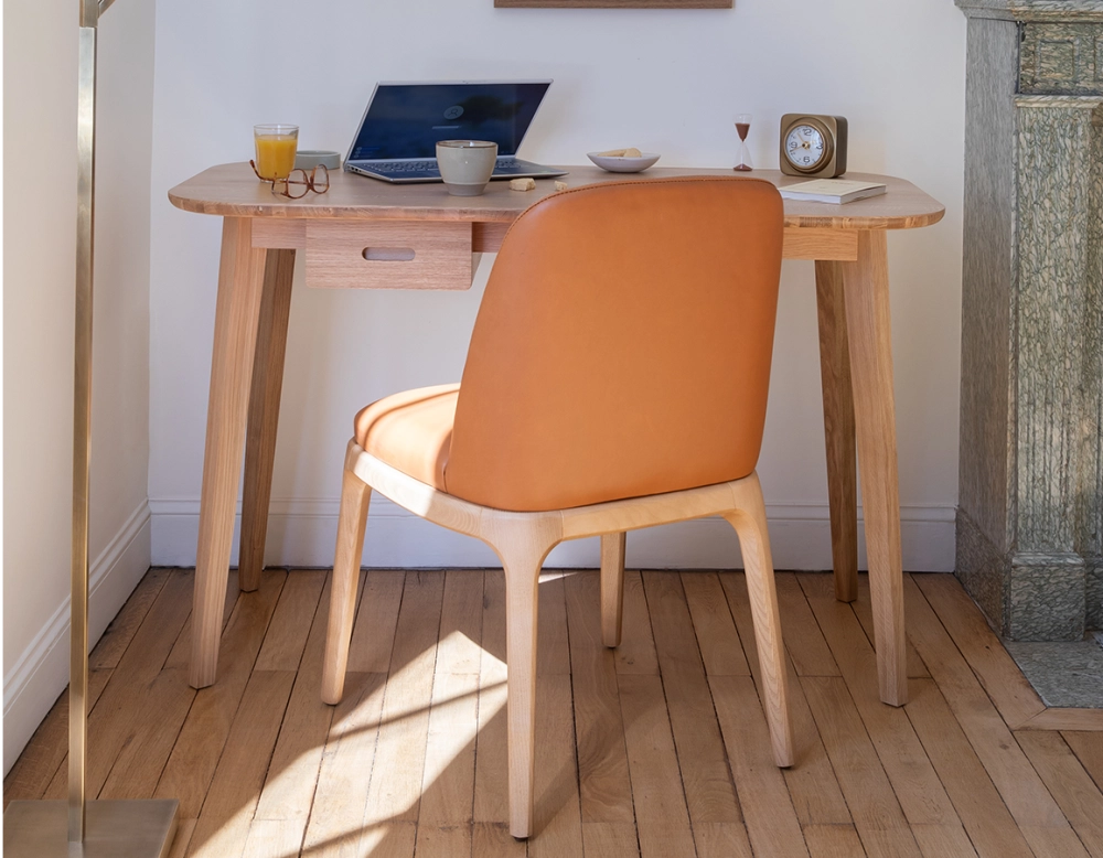 Designer chair natural stained wood and caramel leather