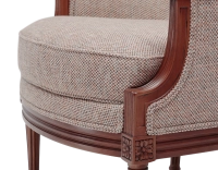 Fauteuil bergère mouluré style Louis XVI bois teinte ancienne et tissu chiné beige, gris et orange