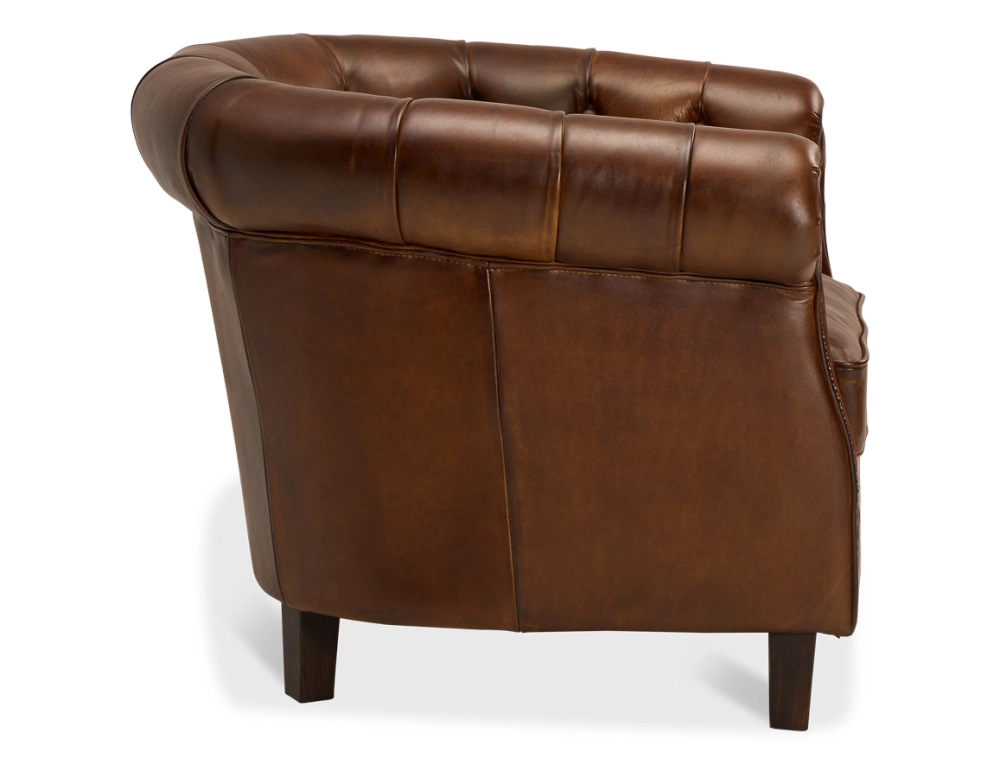 Fauteuil chesterfield cuir marron vintage accoudoirs cloutés